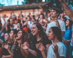 647e8a75f458d2dbf6c0e61b_people-cheering-during-day_a2b4c052b25882a8ac440308bd49a4aa_2000